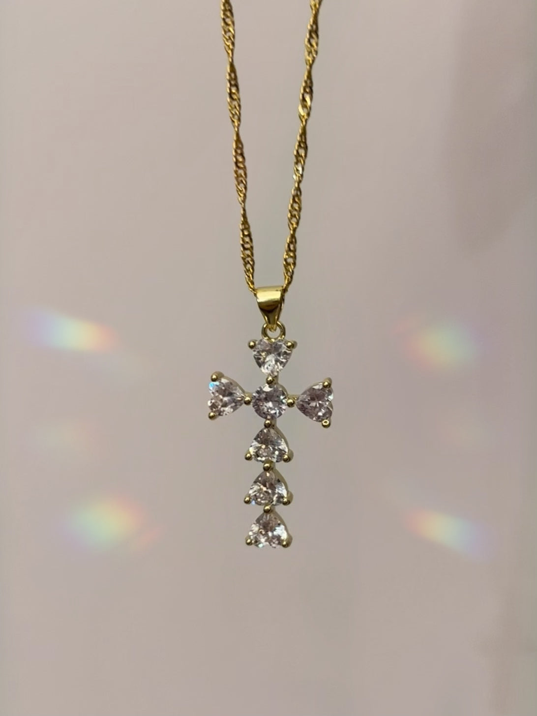 Sparkly cross necklace with cubic zirconia crystals and 14k gold filled. hypoallergenic lead and nickel free.