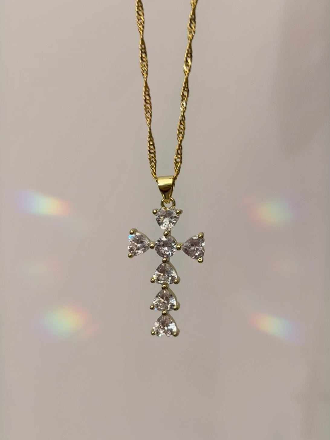 Sparkly cross necklace with cubic zirconia crystals and 14k gold filled. hypoallergenic lead and nickel free. 